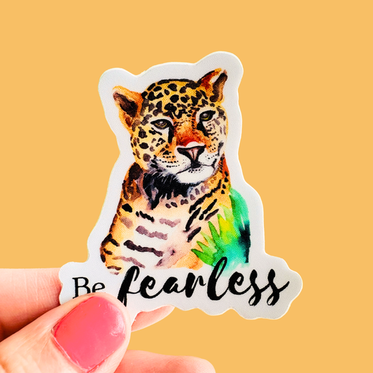Sticker of a leopard with 'Be fearless' text on a yellow background