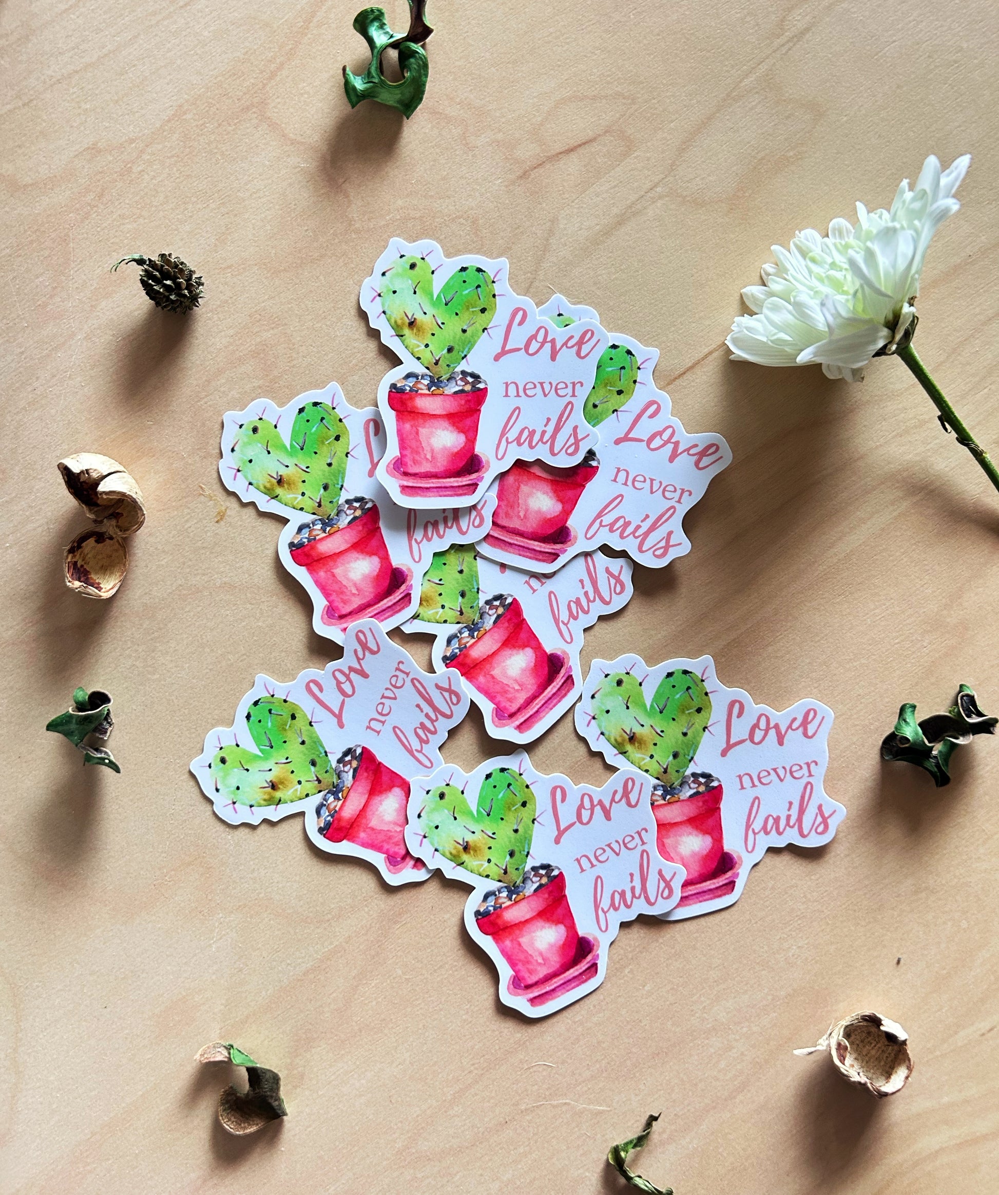 Nature-inspired cactus heart sticker featuring inspirational phrase Love Never Fails