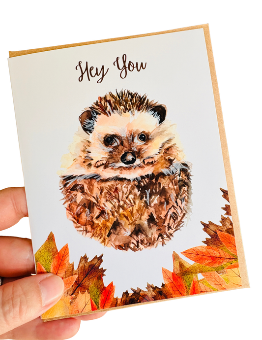Cute hedgehog greeting card with “Hey You” message featuring whimsical artwork by Ingrid Jany