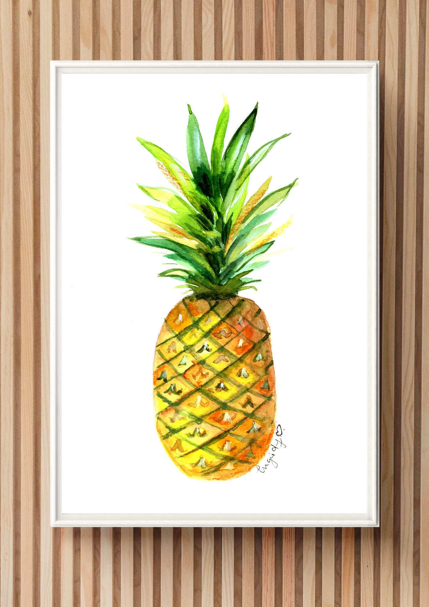 Framed watercolor painting of a pineapple on a wooden wall.