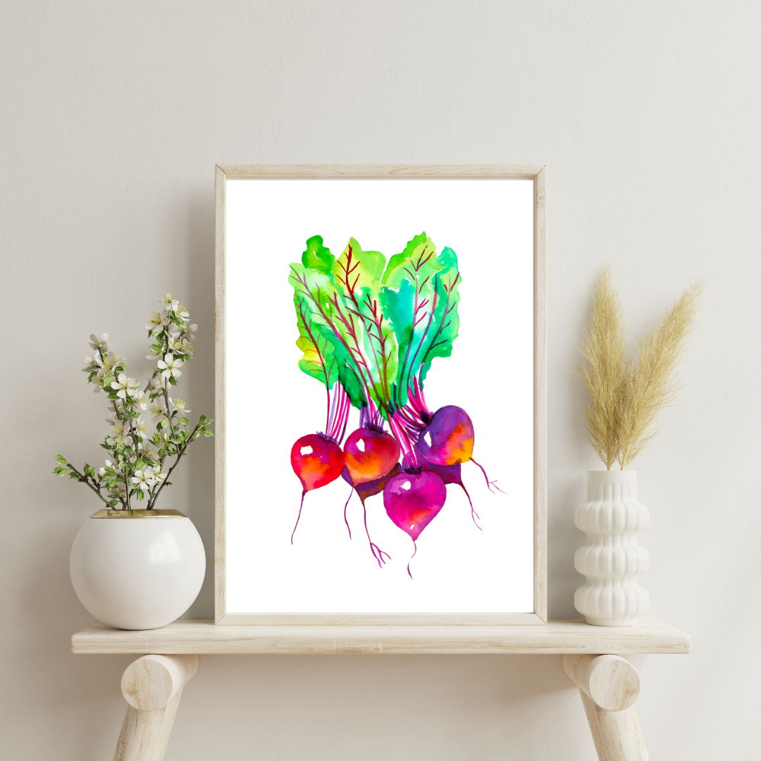 A framed watercolor art print of colorful beets displayed on a wooden easel with decorative elements in the background.