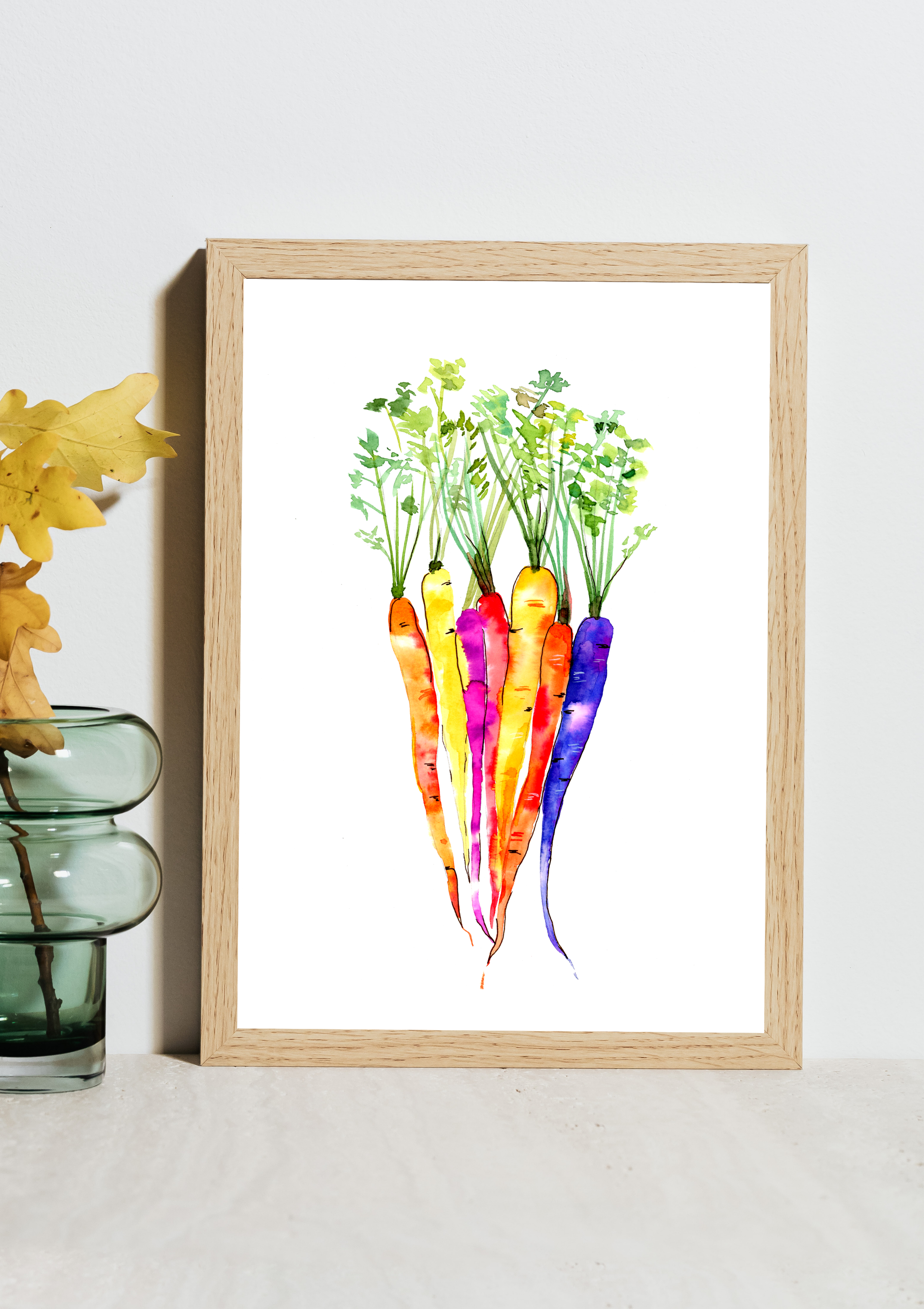Framed artwork of colorful carrots on a white wall